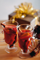 Beautiful Christmas mulled wine in a glass in decorating  New Year interior background