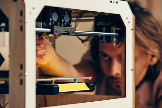 Technician working with 3d printer
