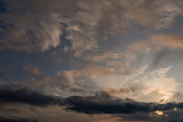 Dramatic sunset sky and clouds with a complex structure.