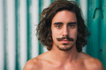 Surfer with moustache at a green background