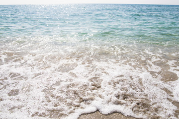 azure sea shore with yellow fine sand. natural texture. background. copyspace