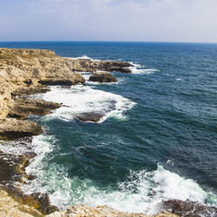 Cape Tarkhankut. Crimea. Rocky slopes and waves at sea. natural wallpaper. copyspace