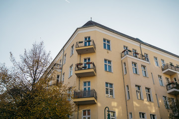orange corner building with clean sky