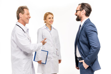 smiling businessman and doctors