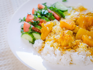 chicken and pumpkin stew in the oven is born with rice and vegetables