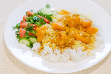 chicken and pumpkin stew in the oven is born with rice and vegetables
