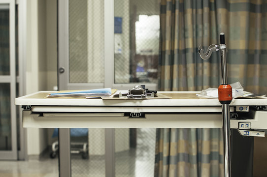 hospital tray with paperwork and a clipboard