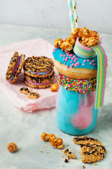 Obraz na płótnie Canvas Color freak shake topping with donut over grey background