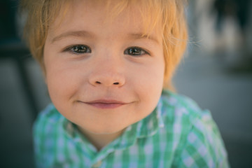 Sweet smile, boy smiling at camera, happy child is at holidays with love looking at camera. Happy childhood and positive emotions. Kind boy, love to the child. Funny face of cute toddler portrait