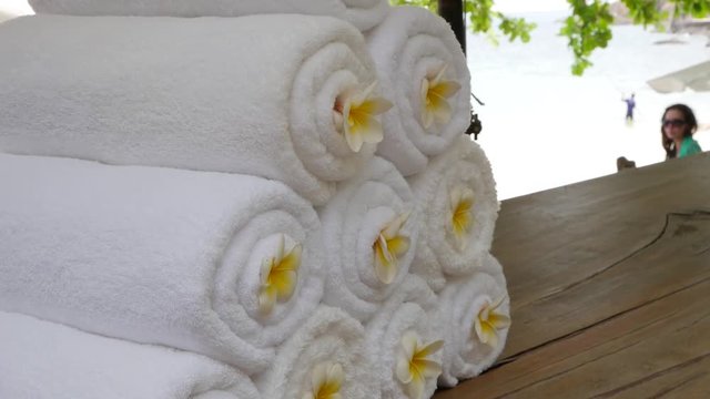 Set of white towels and Frangipani flowers. zen garden for relaxation balance and harmony spirituality or wellness.