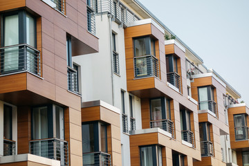 detailed view of modern apartment facade with wooden details