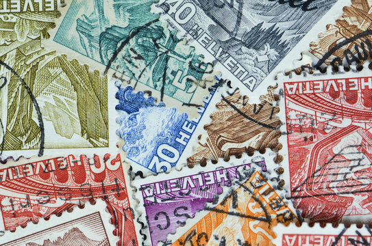 Collection of old Swiss postal stamps from the early 1900s. Helvetia