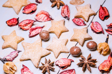 Festive background from cookies and dry leaves