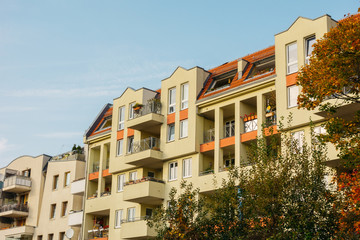 Fototapeta premium typical apartment buildings framed by trees