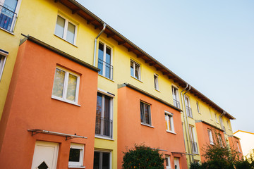 Fototapeta na wymiar orange and yellow facaded row houses at berlin
