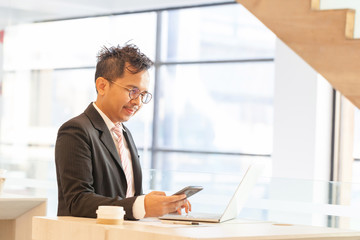 Fototapeta premium Businessman doing online banking.