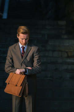 Businessman Looking at the Watch