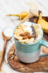 Banana yoghurt with seeds and cornflakes