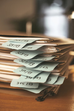 Stack of documents folders on office. Selective focus.