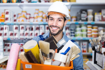 Positive guy builder holding basket with tools