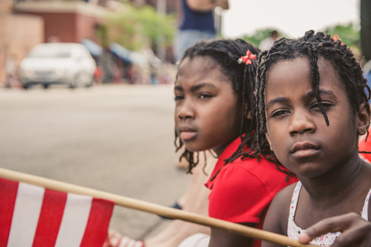 Two African-American Girl With USA Flag at a National Day Parade