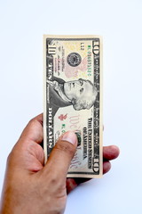 close up of banknote on hand isolated on white background