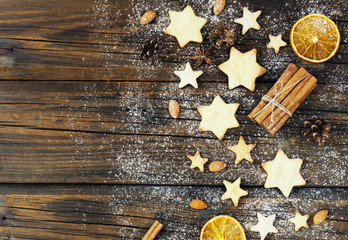 Christmas gingerbread cookies stars on a wooden table and coffe, selective focus