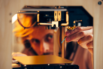 Technician working with 3d printer