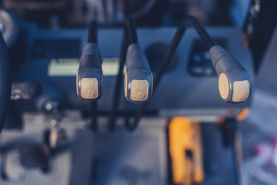Closeup image of the levers on the forklift machine