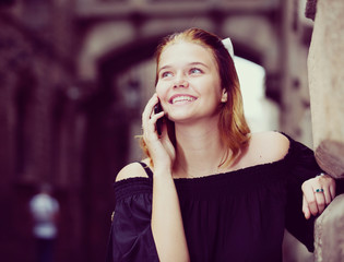 Portrait of girl teenager talking on phone