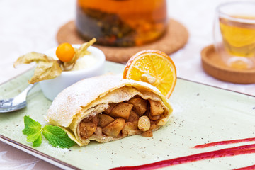 Homemade apple strudel with powdered sugar
