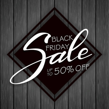 Lettering Black Friday Sale on black wooden background