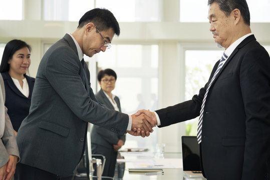 Corporate business people handshaking