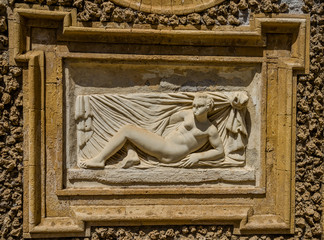Ancient sculpture paintings on a fragment of the wall in the Villa Doria-Pamphili in Rome, Italy