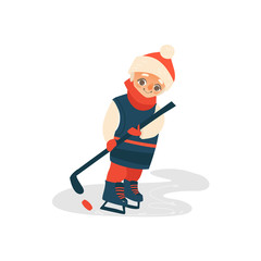 Obraz premium vector cartoon stylized teen boy kid playing ice hockey standing in winter outdoor clothing with funny hat, scarf, ice skating with hockey stick. Isolated illustration on a white background.