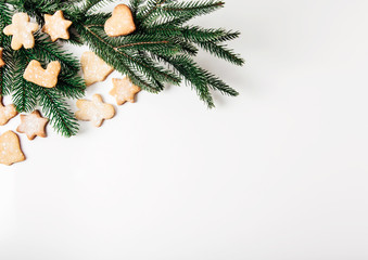 Christmas gingerbread and tree branch.Holiday,new year,Christmas  concept.White background.Flat lay