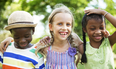 Cute diverse kids playing in the park