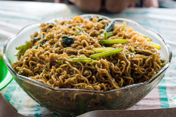 Big bowl of mie goreng at a local warung in Indonesia
