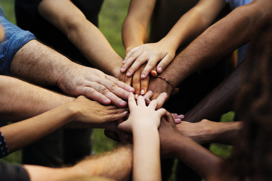 Group of people with their hands together