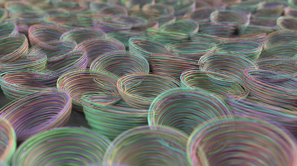 Obraz premium Abstract background from purple, green, blue and orange spiraled coils