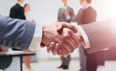 Close up of businessmen shaking hands