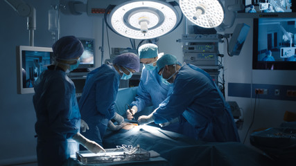 Medical Team Performing Surgical Operation in Modern Operating Room