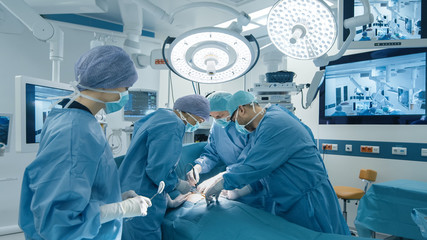 Medical Team Performing Surgical Operation in Bright Modern Operating Room - obrazy, fototapety, plakaty