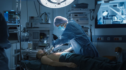 Medical Team Performing Surgical Operation in Modern Operating Room - obrazy, fototapety, plakaty