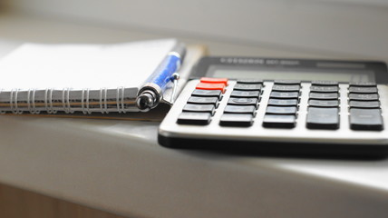 Calculator, pen and paper notepad  Counting on the calculator and record the results in a paper notebook is still relevant tools for office work in various fields of intellectual activity.