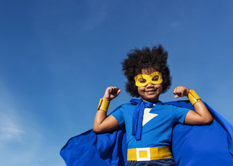 Cute little superhero girl with afro