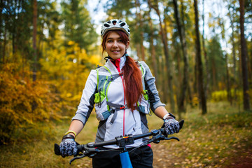 Fototapeta na wymiar Image ofa girl in helmet riding bicycle