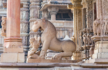 Statue of girl with lion in famous ancient temple in Khajuraho, India