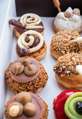 Fresh tasty donuts for Hanukkah celebration in carton box