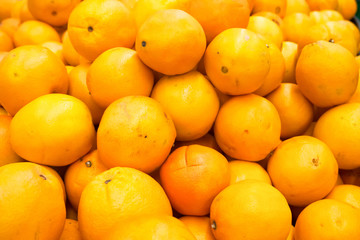 Pile of fresh oranges and mandarins